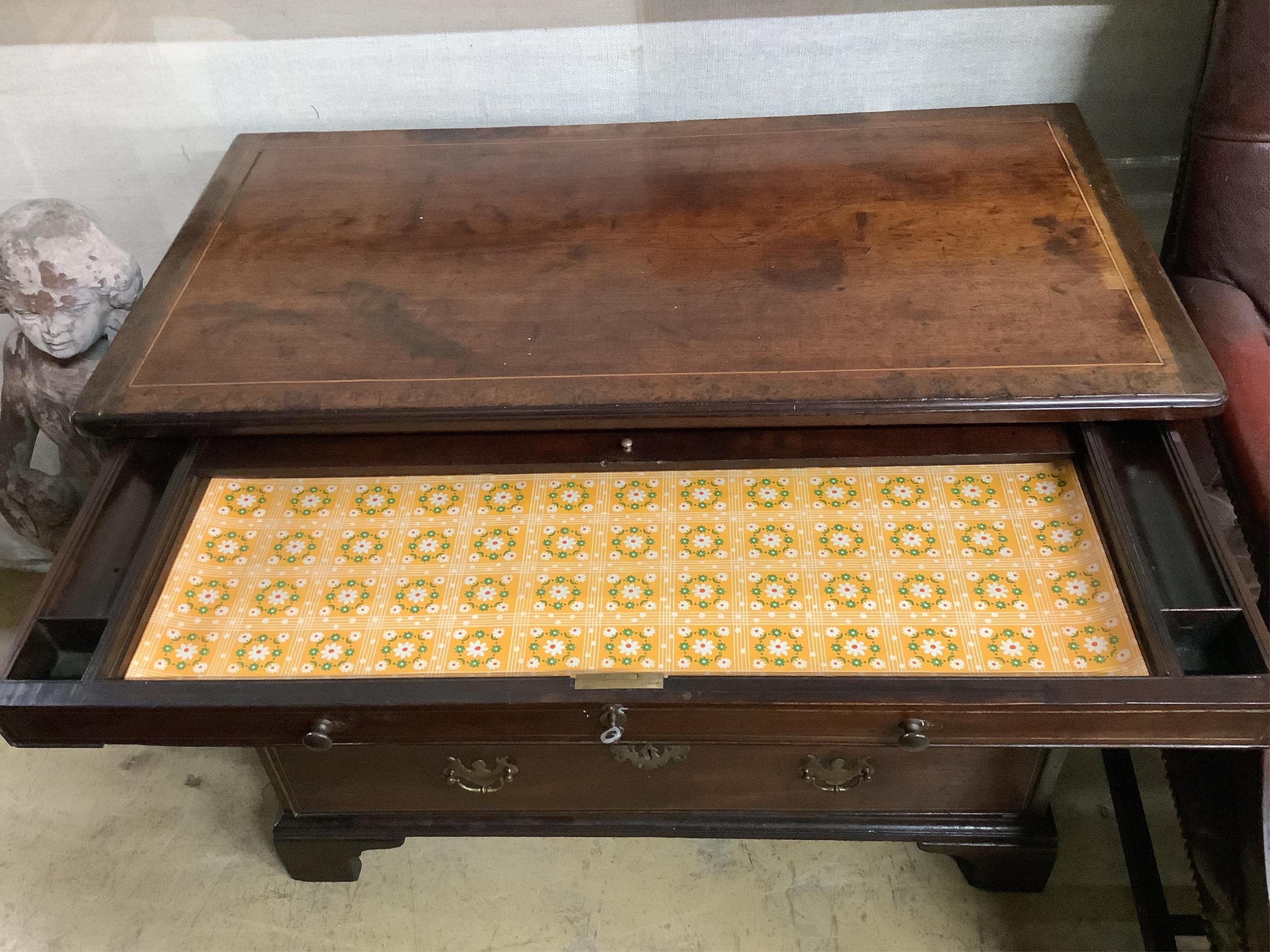 A George III, possibly padouk, brass inlay,dressing chest in the manner of John Channon, width 88cm, depth 47cm, height 74cm. Condition - fair